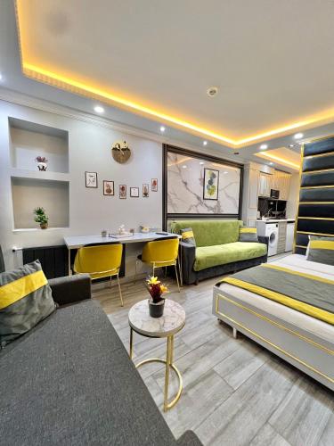 a hotel room with a bed and a living room at TAKSİM LARİSSA RESİDENCE in Istanbul