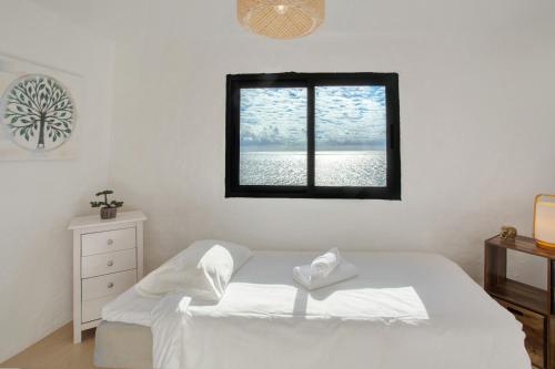 En eller flere senge i et værelse på The Yellow House