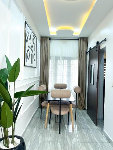 a meeting room with a table and two chairs at Fully Furnished Modern 2 bedroom in jahi in Abuja