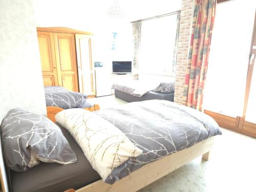a living room with two beds and a couch at Pension in Schwallungen