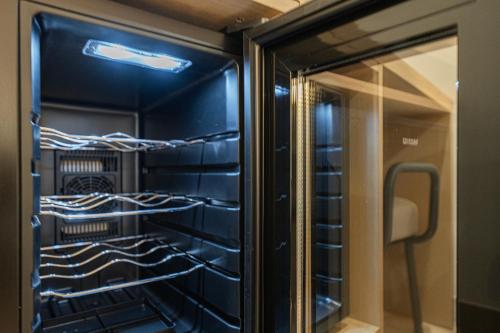 a black refrigerator with lots of racks at Cheonan H-Avenue Cheonan Buldang in Cheonan