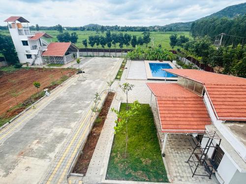 an aerial view of a building with a swimming pool at Echoes in Nandigunda