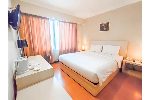 Postel nebo postele na pokoji v ubytování KAWANA HOTEL