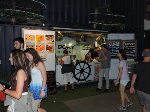 a group of people standing around a food truck at Best Western Airport 85 Motel in Brisbane