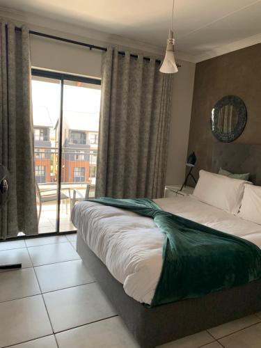 Ένα ή περισσότερα κρεβάτια σε δωμάτιο στο Sushii luxury apartment The Blyde