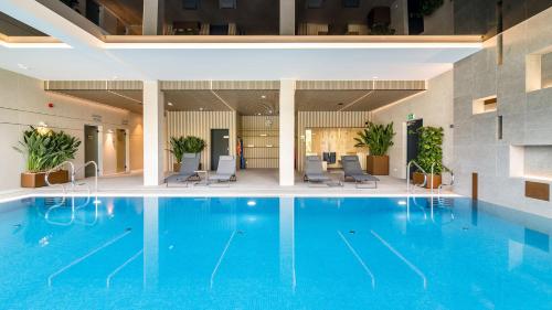 Piscina de la sau aproape de MW APARTAMENTY - Mechelinki - Anchoria Holiday SPA