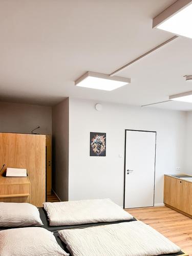 two beds in a room with white walls at Erlebniswelt Resort Apartment 9 in Reken