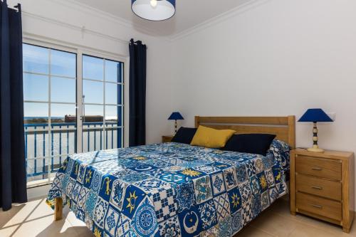 Ένα ή περισσότερα κρεβάτια σε δωμάτιο στο Blue Villa by ALGARVEMANTA