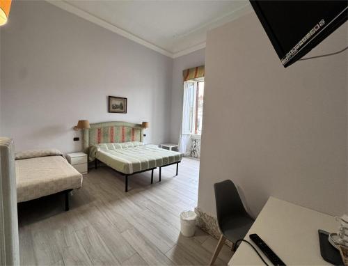 Postel nebo postele na pokoji v ubytování Hotel Ely
