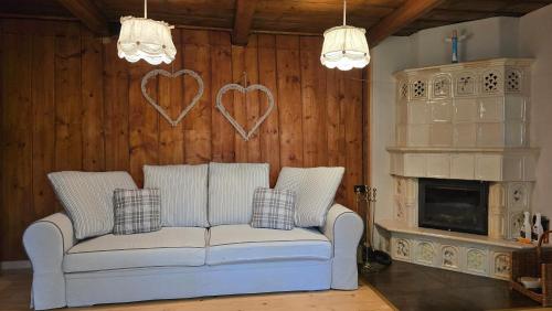 a living room with a couch and a fireplace at Łapszanka 29 in Łapszanka