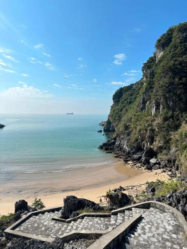 a stairway leading down to a beach at Eden Hotel Cát Bà in Cat Ba