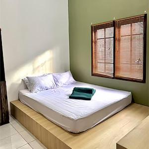 Ένα ή περισσότερα κρεβάτια σε δωμάτιο στο JM Stay