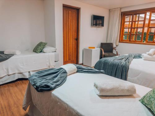 Postel nebo postele na pokoji v ubytování Pousada Bella Giornata