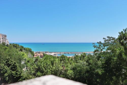 a view of the ocean and a beach with trees at Gianna's House - YourPlace Abruzzo in Ortona