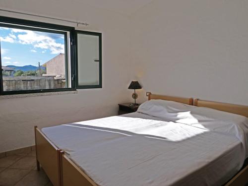 Ένα ή περισσότερα κρεβάτια σε δωμάτιο στο Residence fiorito spiaggia 300m by PortoOttioluAffitti
