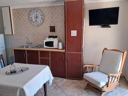 Kuchyň nebo kuchyňský kout v ubytování Jakkalsdraai Guest House