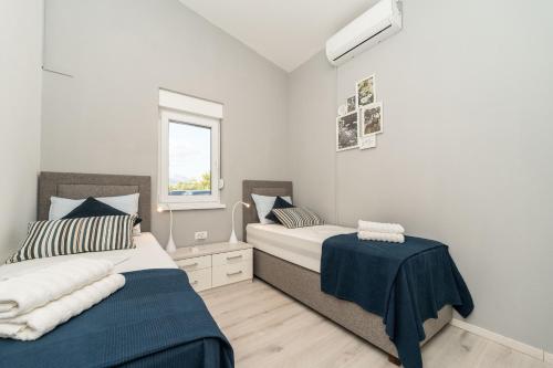 Ένα ή περισσότερα κρεβάτια σε δωμάτιο στο Villa Novigrad ZadarVillas
