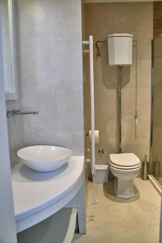a bathroom with a sink and a toilet at Waterfront Historical Villa Perast in Perast