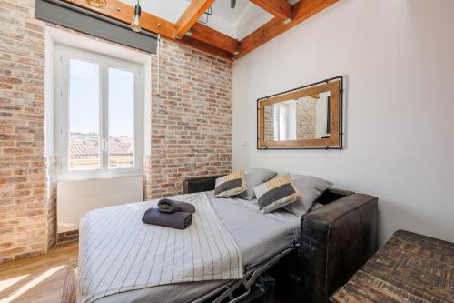 En eller flere senge i et værelse på Duplex Factory II Hyper Centre