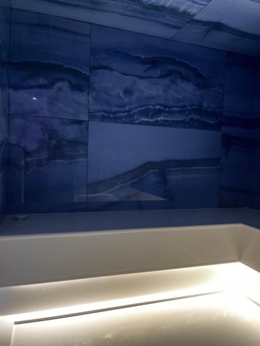a white boat with a painting on the wall at Casa Vacanze Maraldo in Marina di Camerota