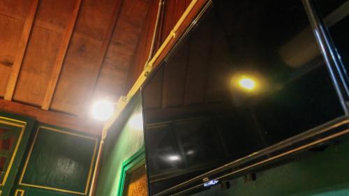 a close up of a window with lights on it at Cokro Hinggil - Traditional View in Sleman