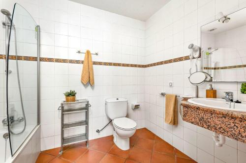 a bathroom with a toilet and a sink and a shower at Finca Llucasaldent Menor by Menorca Vacations in Alaior