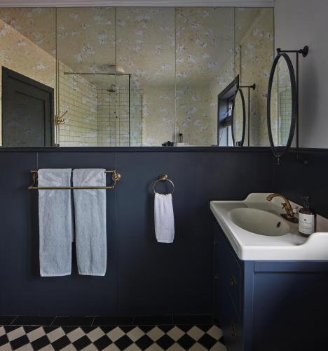 a bathroom with a sink and a mirror at Hvammsvík Nature Resort in Kjósahreppur