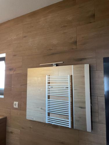 a wooden wall with a window in a room at SOBE DELUX Vodice in Vodice