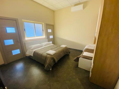 Postel nebo postele na pokoji v ubytování B&B l'angoletto
