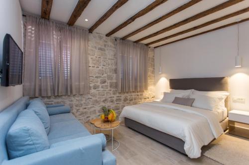 Posteľ alebo postele v izbe v ubytovaní Bifora Heritage Hotel
