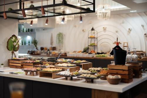 a buffet line with many different types of food at Blue Carpet Luxury Suites in Pefkohori