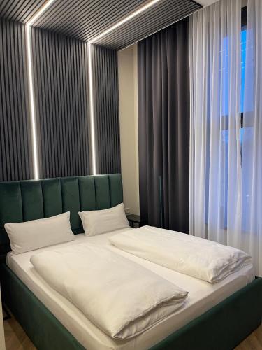 En eller flere senge i et værelse på Motel Blue Messe