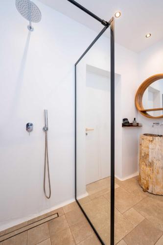a shower in a bathroom with a glass door at Villa Zina Sunset View St Lazaros 7 plus 1 Bedroom in Psarou
