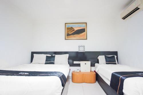 Katil atau katil-katil dalam bilik di Townhouse Oak Ilir Timur I Near Ptc Mall