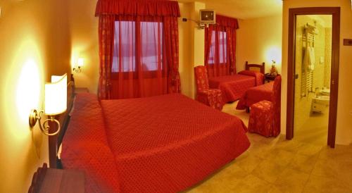 Postel nebo postele na pokoji v ubytování Hotel LuSi