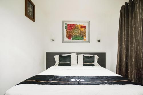 Katil atau katil-katil dalam bilik di Townhouse Oak Ilir Timur I Near Ptc Mall