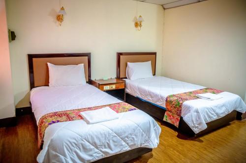 Lukmuang 2 Hotelにあるベッド