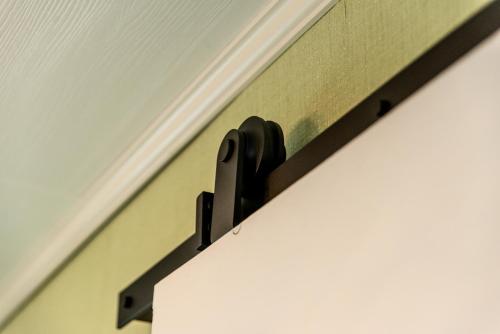 a door opener hanging on a wall at Photoeverhome in Bengtsfors