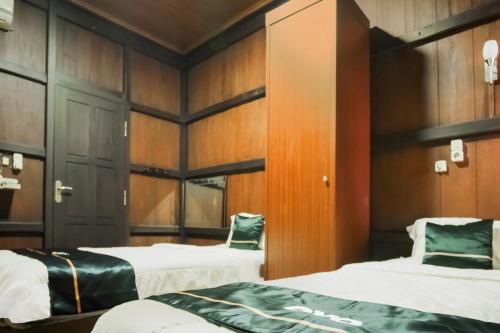 Katil atau katil-katil dalam bilik di Townhouse Oak Ilir Timur I Near Ptc Mall