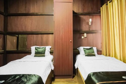 Katil atau katil-katil dalam bilik di Townhouse Oak Ilir Timur I Near Ptc Mall
