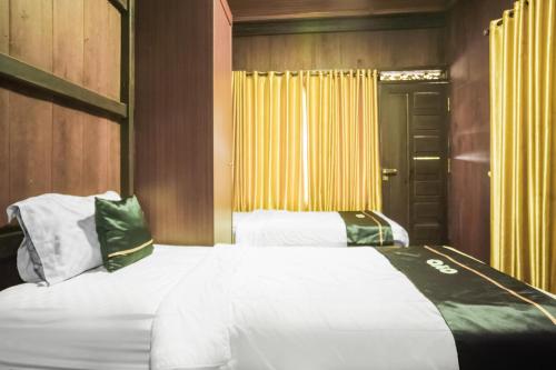 Katil atau katil-katil dalam bilik di Townhouse Oak Ilir Timur I Near Ptc Mall