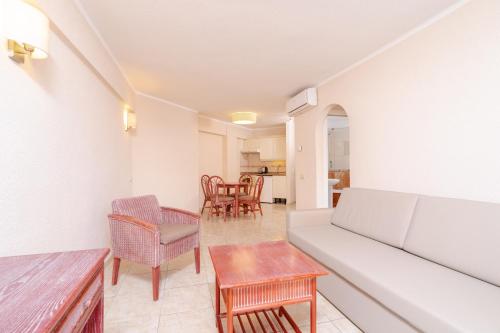 a living room with a couch and chairs at HOVIMA Santa María in Adeje