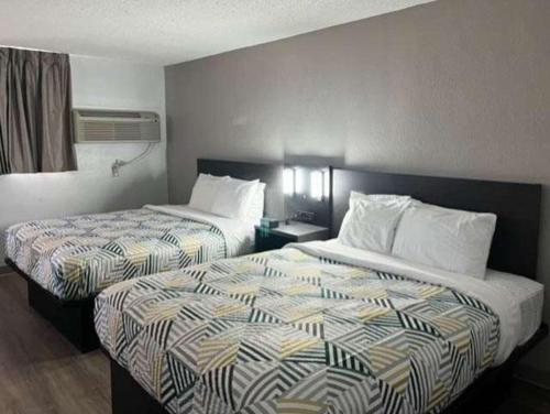 a hotel room with two beds in a room at Motel 6 Pecos TX in Pecos