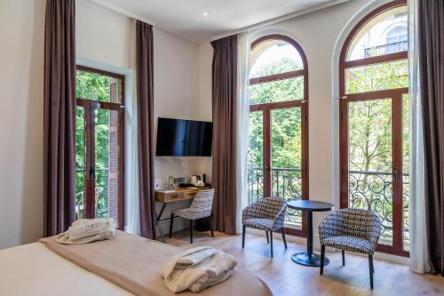Postel nebo postele na pokoji v ubytování Abba San Sebastián Hotel