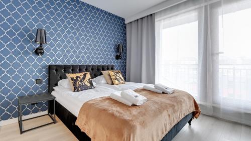 Postel nebo postele na pokoji v ubytování Comfortable Apartments with Access to the Gym Dom & House