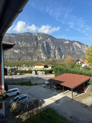 a view of a mountain from a house with a picnic table at Nave San Rocco, Trentino in Nave San Rocco