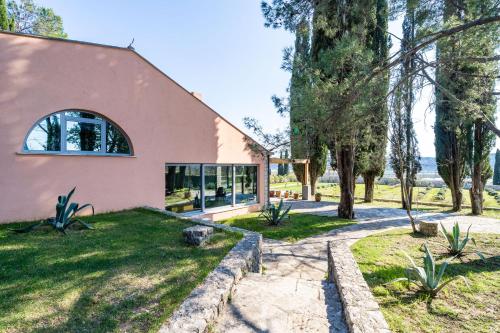 a house with a large window on the side of it at Vila Agava, Konavle in Gruda