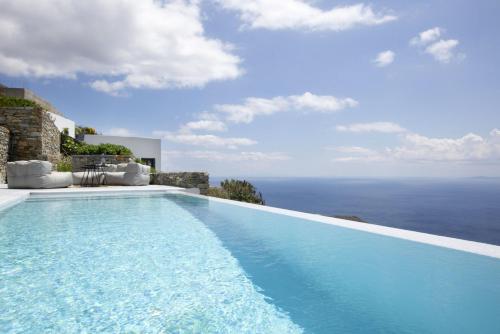a swimming pool with a view of the ocean at House G in Kardiani Tinos in Kardiani