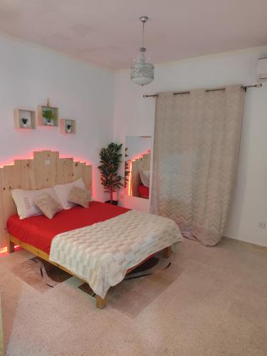 a bedroom with a large bed in a room at Love room jacuzzi in Say