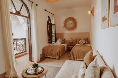 Postel nebo postele na pokoji v ubytování Riad Bamaga